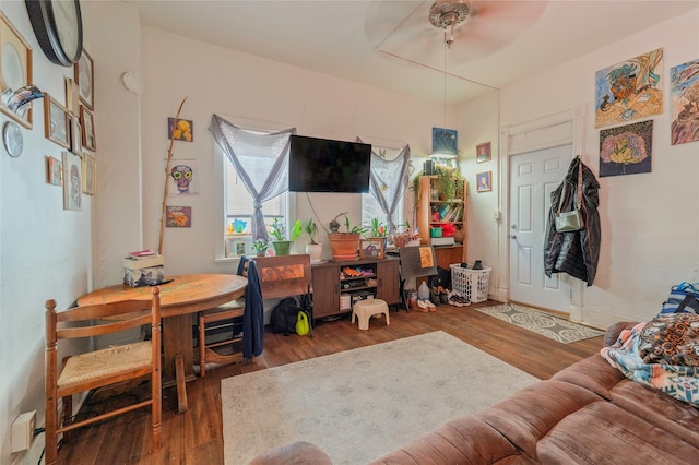 interior space featuring ceiling fan and wood finished floors