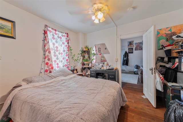 bedroom with dark wood-type flooring and ceiling fan