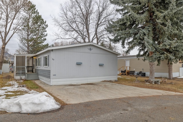 view of side of property featuring driveway