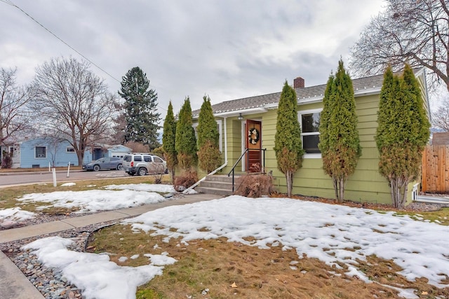 view of front of property featuring a chimney