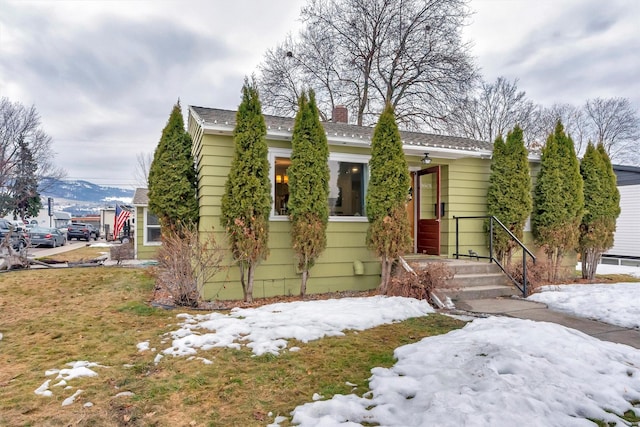 view of front of home with a chimney