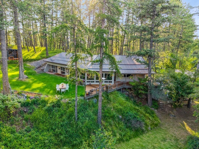 456 Peaceful Dr, Bigfork, MT 59911 - rear view of house with a yard, stairway, and a metal roof
