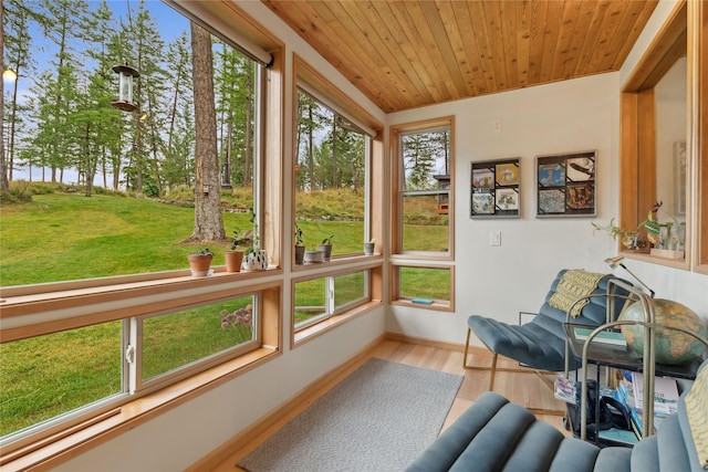 sunroom with a wealth of natural light and wood ceiling