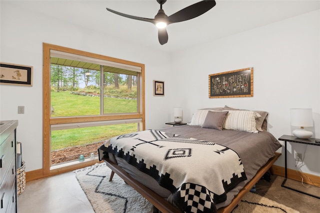 bedroom with baseboards and ceiling fan