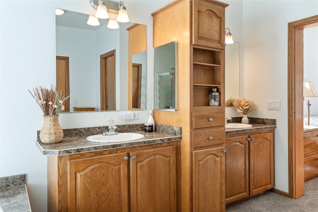 full bath with two vanities and a sink