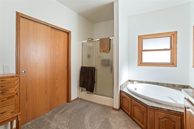 bathroom featuring carpet, a shower stall, and a bath