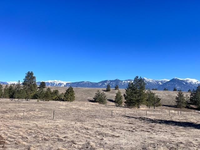 mountain view featuring a rural view