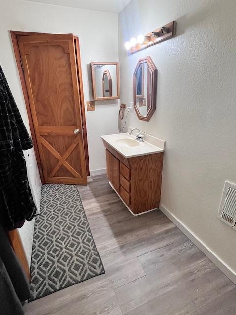 116 Happy Holw, Eureka, MT 59917 - bathroom featuring wood finished floors and vanity