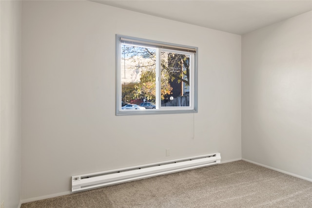 unfurnished room featuring carpet floors, baseboards, and a baseboard heating unit