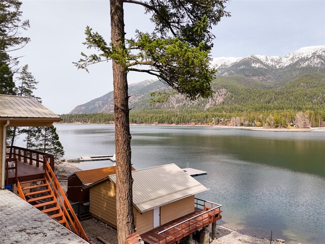 237 Lake Blaine Dr, Kalispell, MT 59901 - dock area featuring a view of trees and a water and mountain view