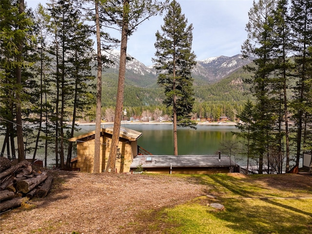 237 Lake Blaine Dr, Kalispell, MT 59901 - dock area featuring a view of trees and a water and mountain view
