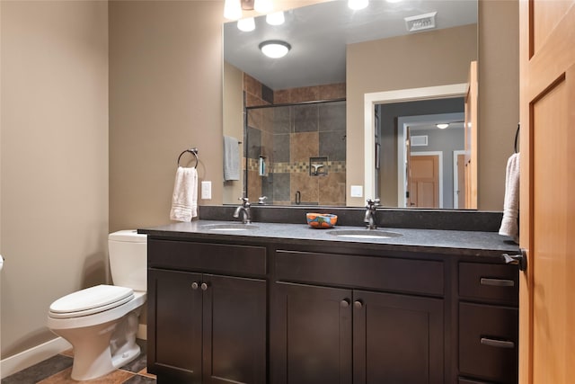 full bathroom with a stall shower, visible vents, a sink, and toilet