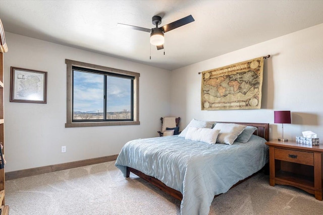 bedroom with carpet floors, ceiling fan, and baseboards