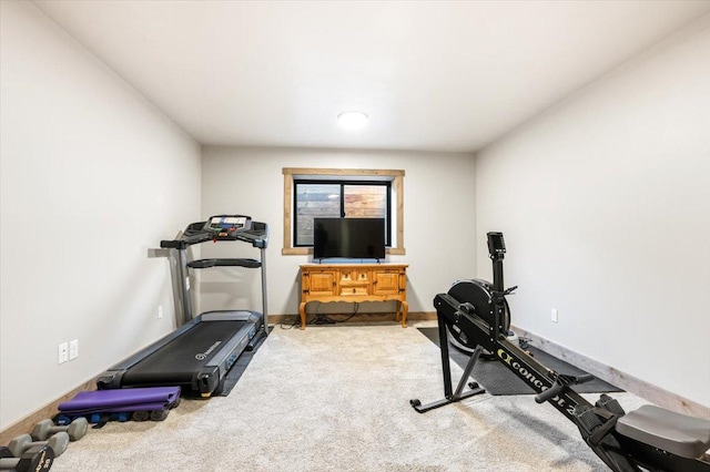 workout area with carpet floors and baseboards