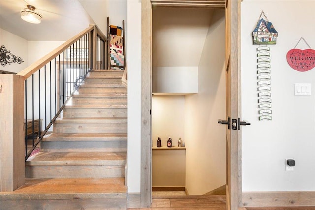 stairs with wood finished floors