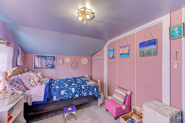 bedroom with vaulted ceiling and carpet floors