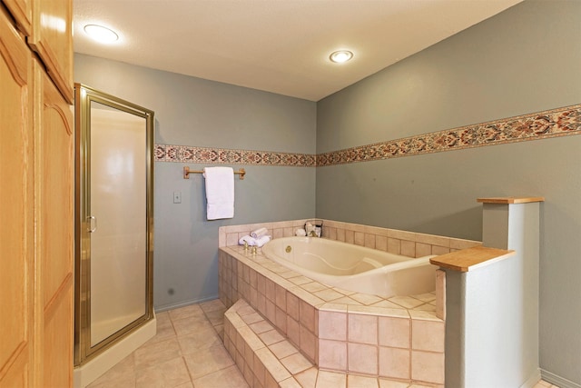 full bath featuring tile patterned floors, a shower stall, and a bath