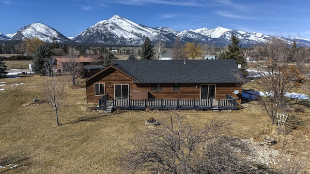 log cabin featuring a deck with mountain view