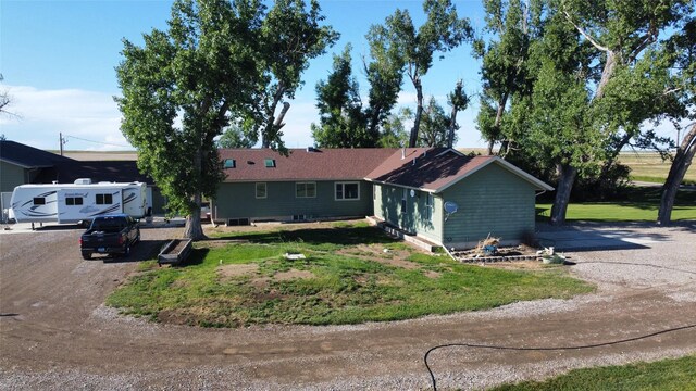 ranch-style home with a front yard