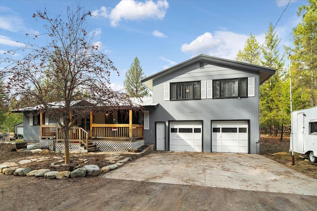view of front of property featuring aphalt driveway and an attached garage