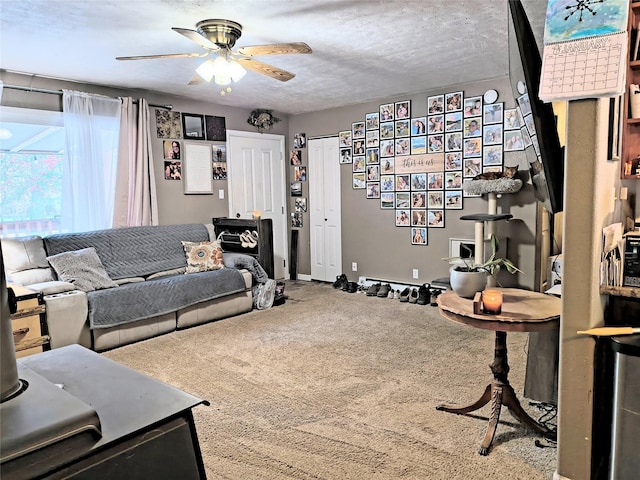 living area with carpet flooring and ceiling fan