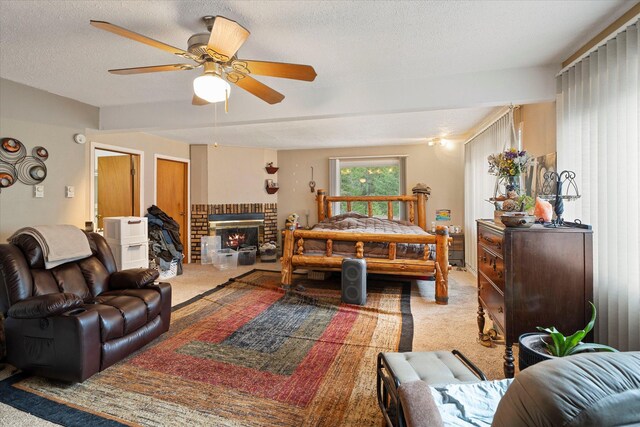 carpeted living room featuring a ceiling fan and a textured ceiling