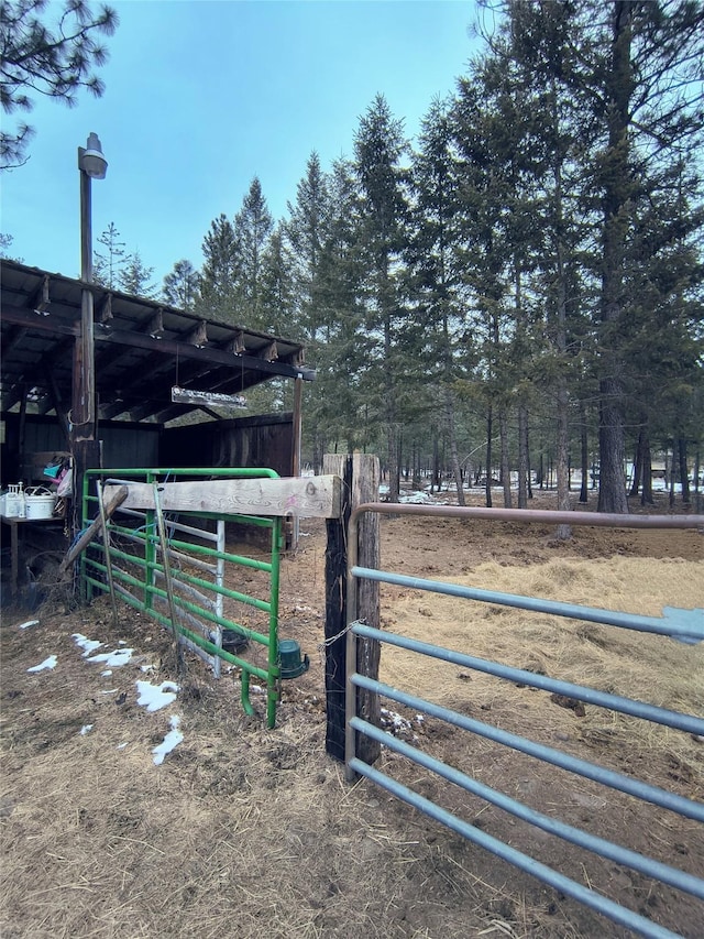 view of yard featuring an outbuilding and an exterior structure