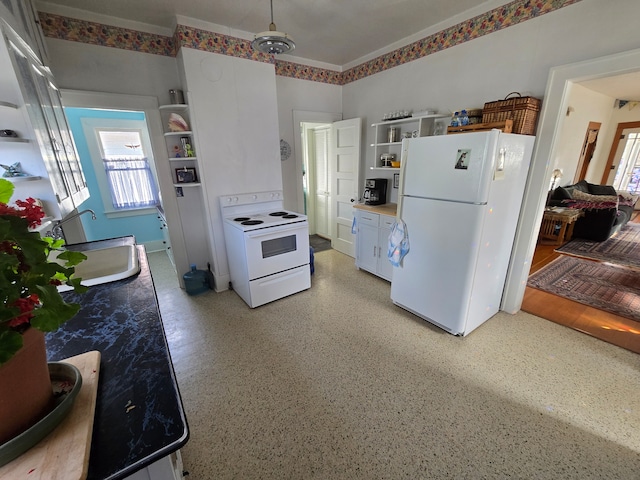 324 1st Ave NW, Choteau, MT 59422 - kitchen featuring light countertops, open shelves, a sink, and white appliances
