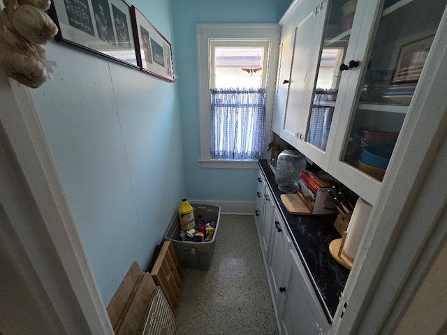 324 1st Ave NW, Choteau, MT 59422 - interior space with speckled floor and baseboards