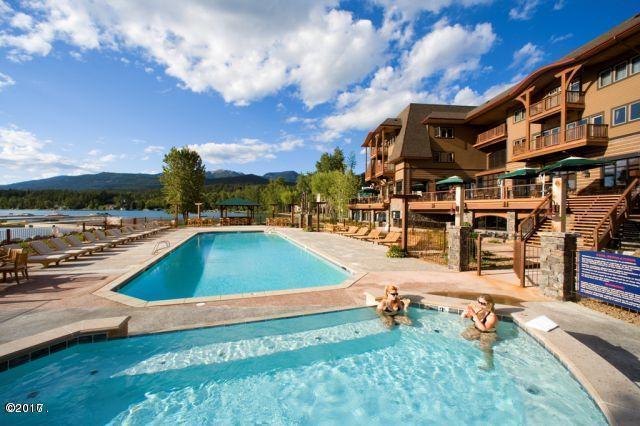 community pool featuring a patio and a mountain view