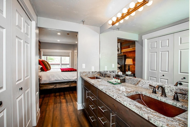 1400 Wisconsin Ave Unit 212, Whitefish, MT 59937 - ensuite bathroom with double vanity, wood finished floors, and a closet