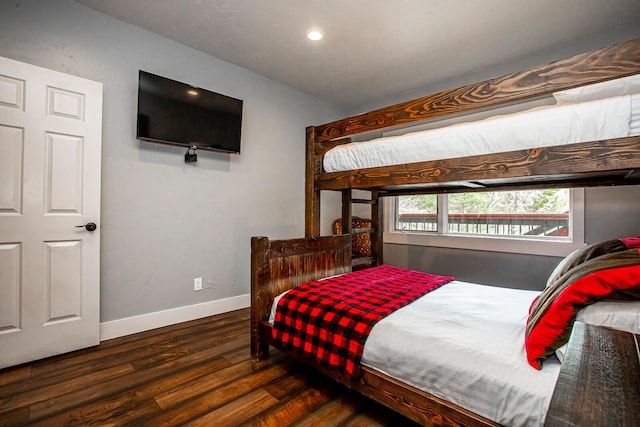 bedroom featuring recessed lighting, wood finished floors, and baseboards