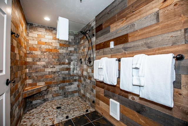 1400 Wisconsin Ave Unit 212, Whitefish, MT 59937 - bathroom featuring walk in shower and wooden walls