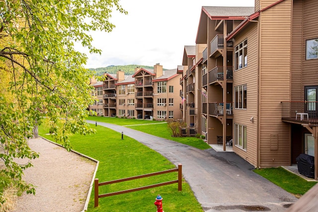 view of home's community with a yard