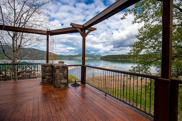 wooden deck with a water view