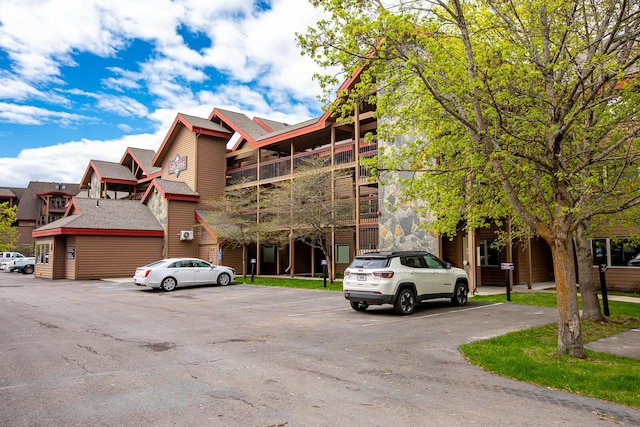 1400 Wisconsin Ave Unit 212, Whitefish, MT 59937 - view of building exterior featuring uncovered parking
