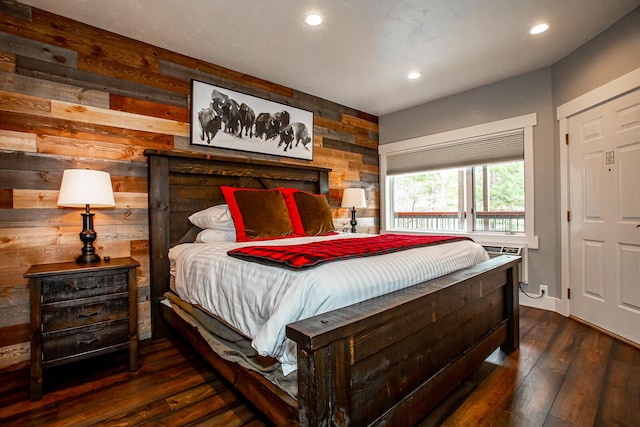 1400 Wisconsin Ave Unit 212, Whitefish, MT 59937 - bedroom with wood walls, recessed lighting, and dark wood-style flooring
