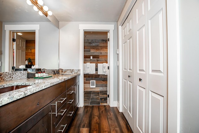 bathroom with visible vents, wood finished floors, and vanity