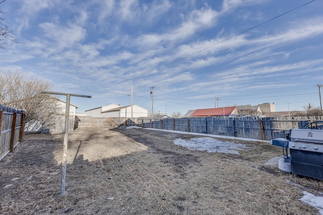 view of yard with a fenced backyard