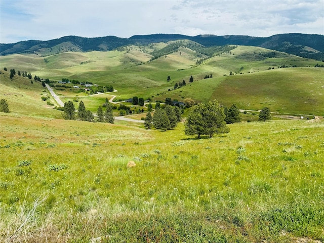 mountain view featuring a rural view