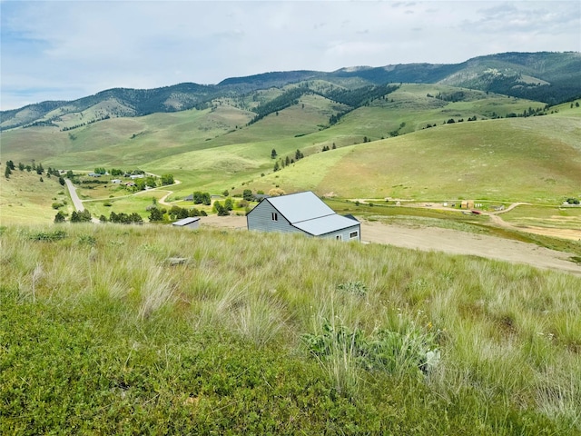 view of mountain feature with a rural view