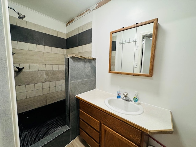 bathroom featuring a shower stall and vanity