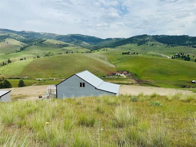 exterior space featuring a mountain view and a rural view