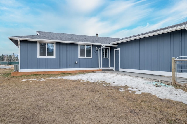 exterior space with roof with shingles