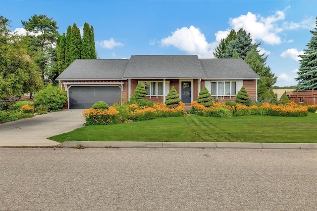 ranch-style home with an attached garage, a front lawn, and concrete driveway