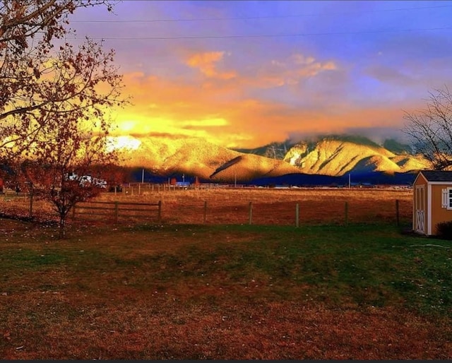 316 3rd Ave, Saint Ignatius, MT 59865 - yard at dusk featuring a storage unit and a rural view