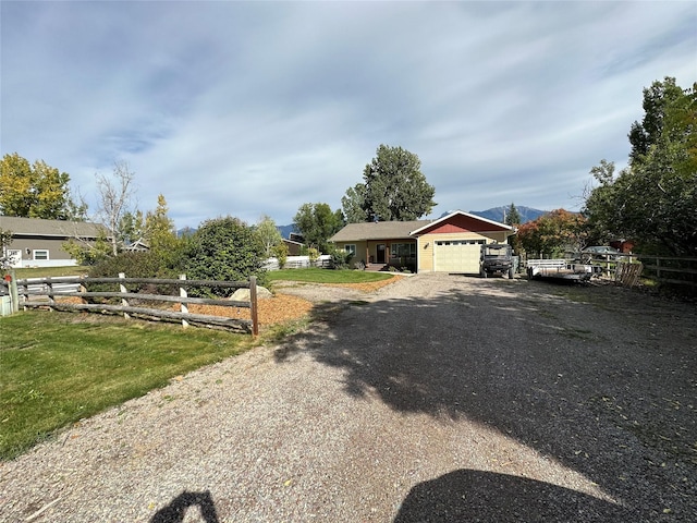 316 3rd Ave, Saint Ignatius, MT 59865 - view of front of house with an attached garage and driveway