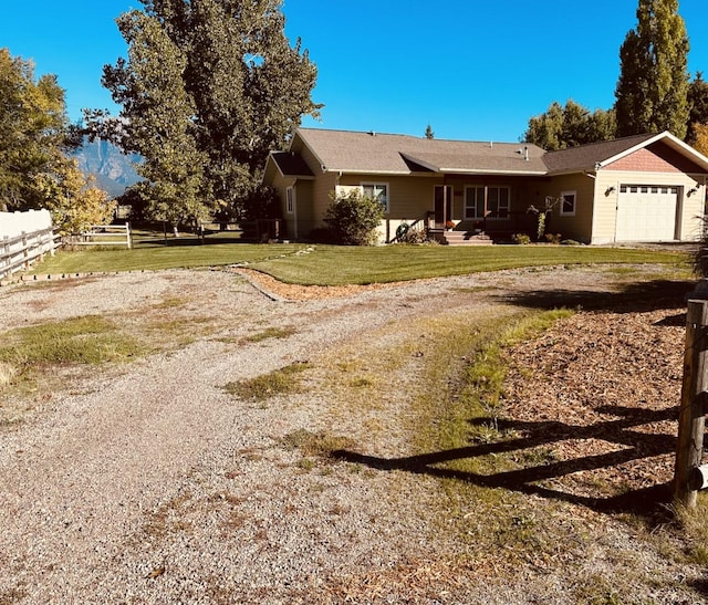 316 3rd Ave, Saint Ignatius, MT 59865 - ranch-style house with driveway and an attached garage