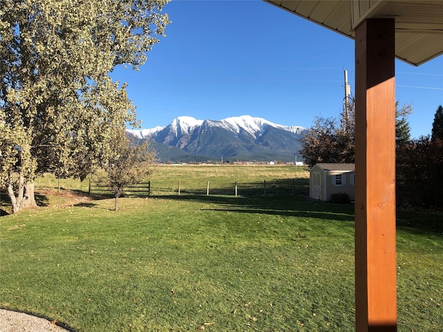 316 3rd Ave, Saint Ignatius, MT 59865 - view of yard featuring a storage shed, a mountain view, and a rural view