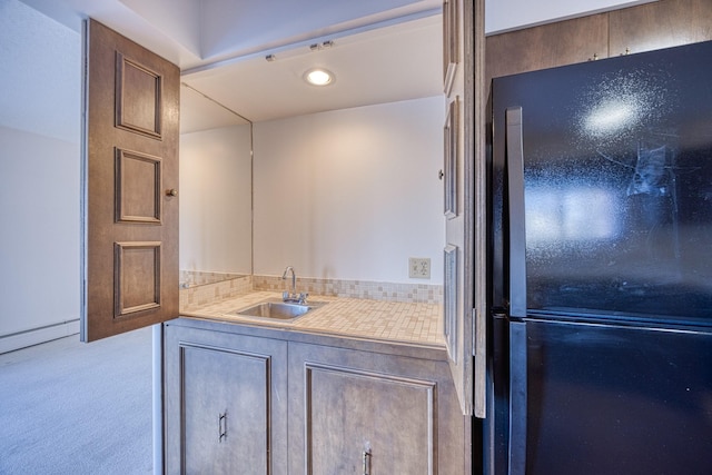 bathroom featuring a baseboard heating unit and vanity